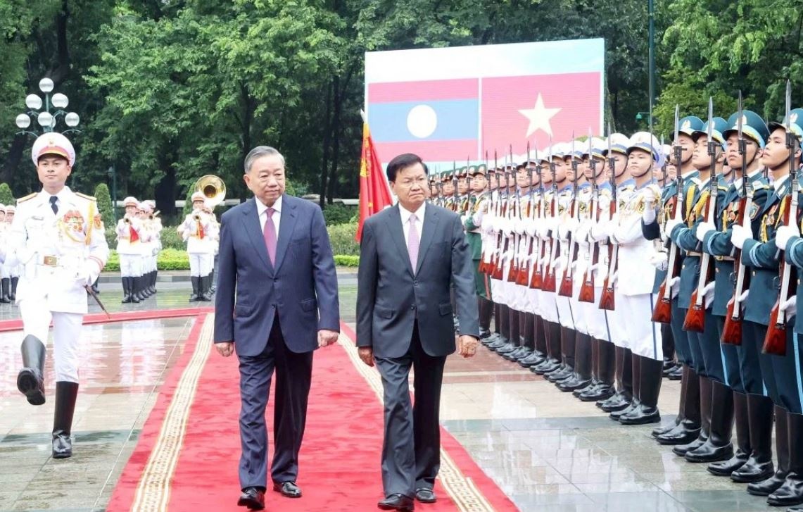 Tong Bi thu, Chu tich nuoc To Lam chu tri Le don Tong Bi thu Lao hinh anh