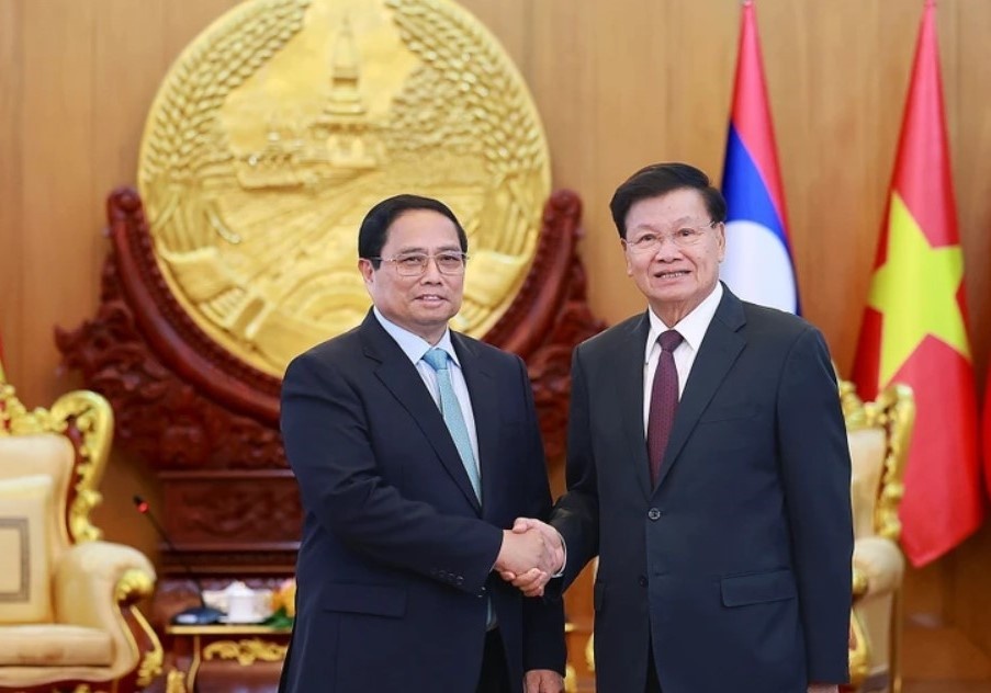 Lanh dao Viet Nam - Lao nhat tri thuc hien hieu qua cac thoa thuan hinh anh