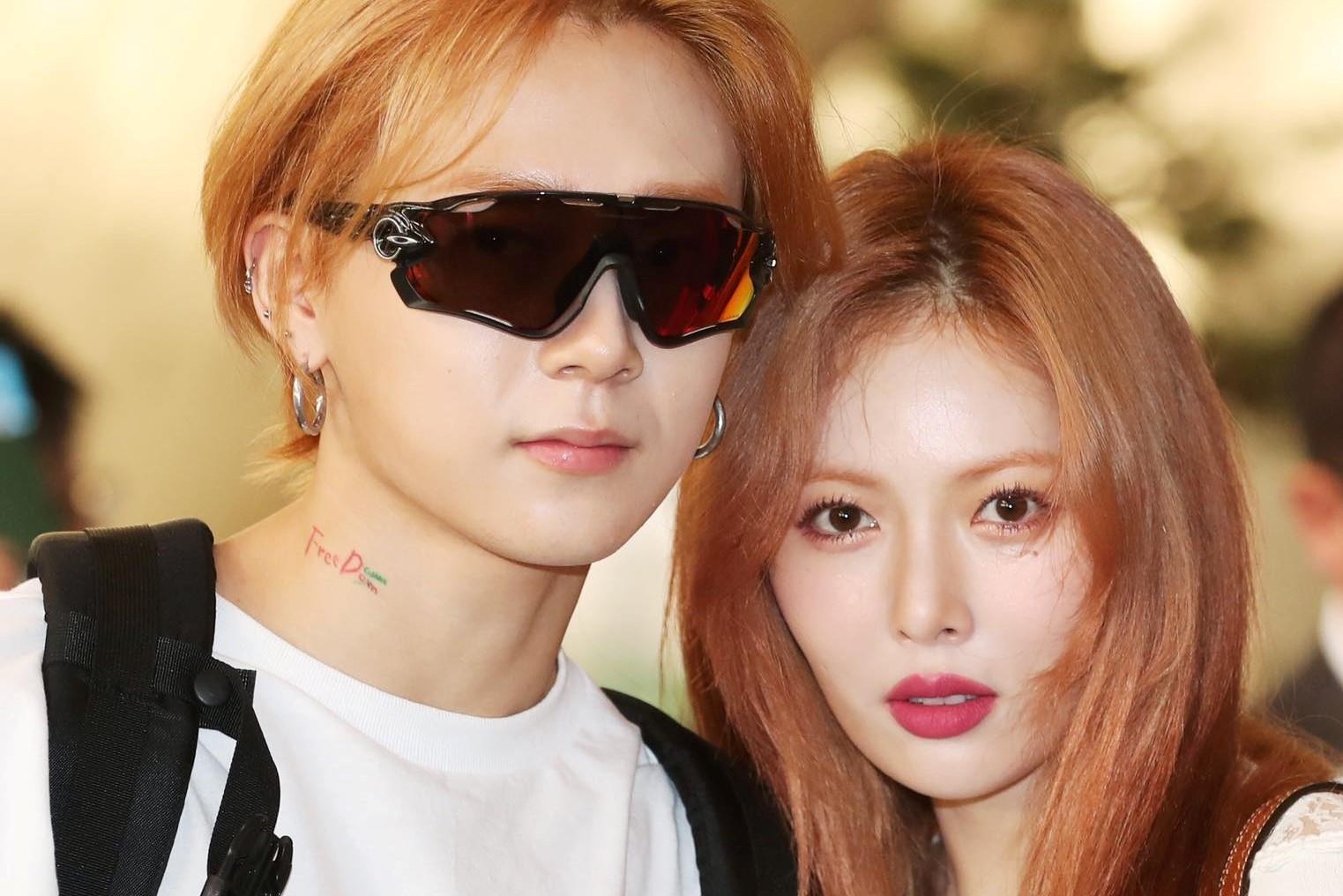 HyunA khoe eo sieu nho, xinh dep ben ban trai o san bay di Nhat hinh anh