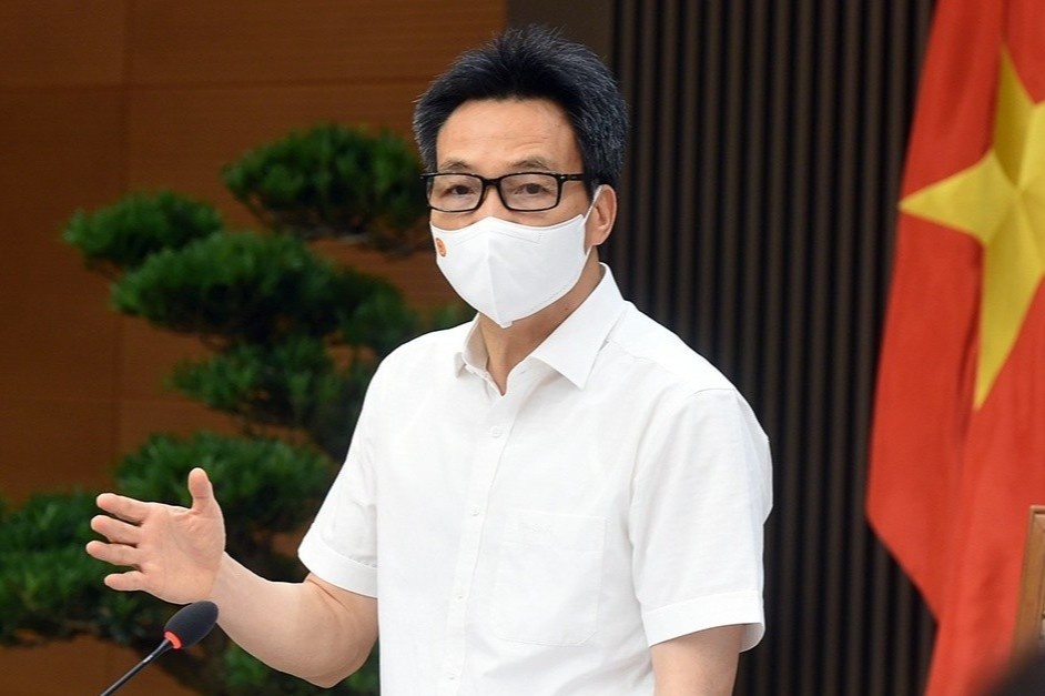 'Khong yeu cau doanh nghiep tra phi tiem vaccine cho nguoi lao dong' hinh anh