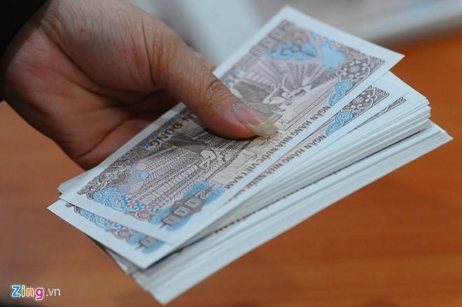 Doi tien le sau Tet: 100.000 dong 'an' 50.000 dong hinh anh