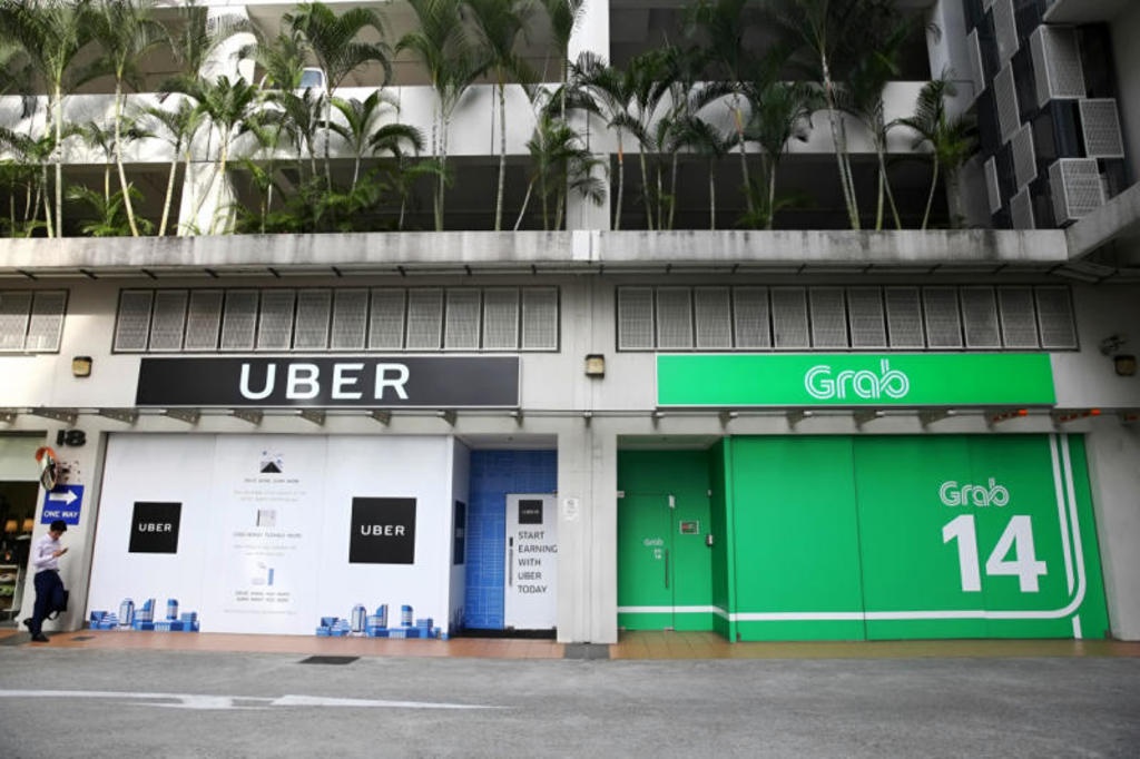 Uber Dong Nam A se cong bo ban minh cho Grab hom nay? hinh anh