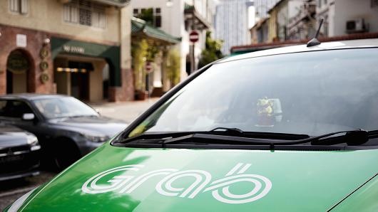 Singapore dieu tra thuong vu Grab mua Uber hinh anh