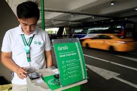 Philippines yeu cau hoan vu sap nhap Uber vao Grab vo thoi han hinh anh