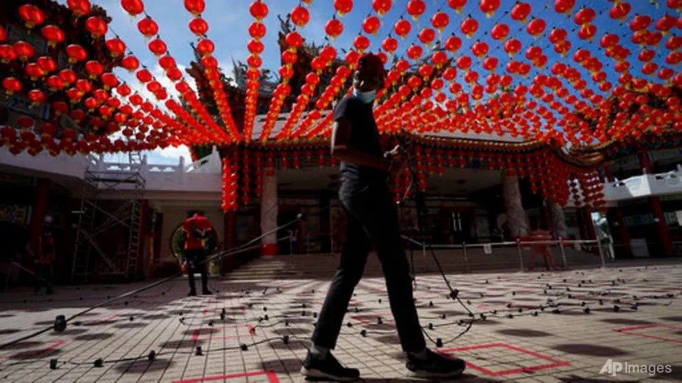 Malaysia cam nguoi dan di chuc Tet hinh anh