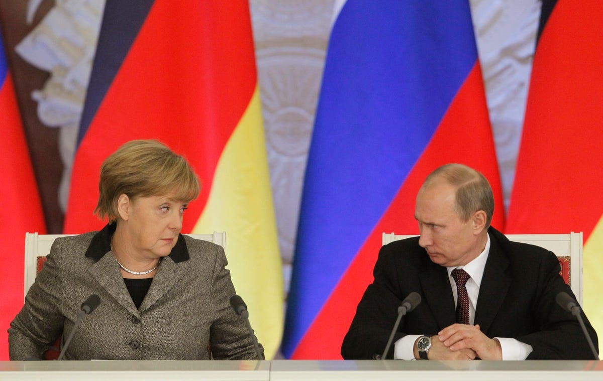 Ba Merkel den gap ong Putin truoc khi roi nhiem so hinh anh
