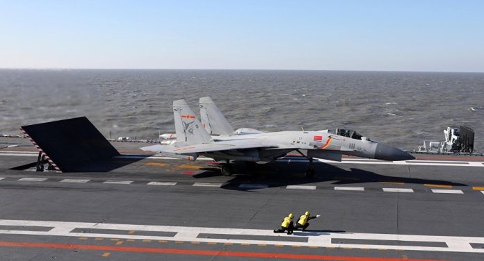 Tiem kich J-15 lan dau cat canh tren tau san bay Son Dong hinh anh