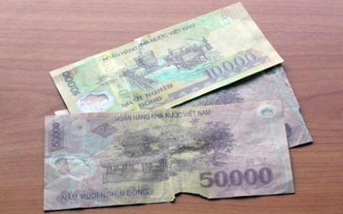Chat luong dong tien duoc cho la 'xuong cap' hinh anh
