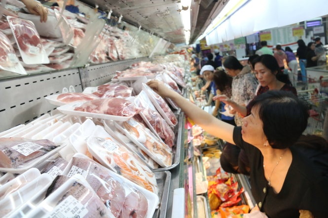 Gia xang giam, ai duoc loi? hinh anh