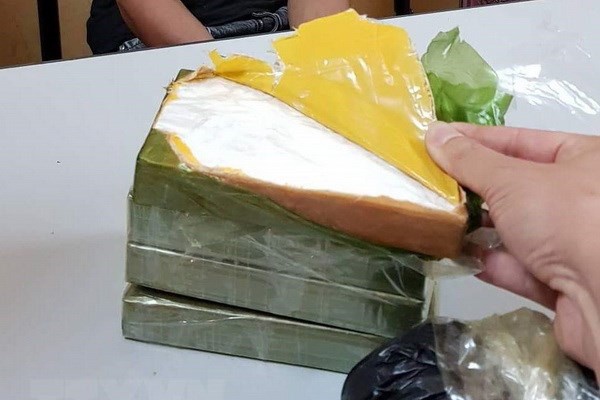 Tu hinh 2 nguoi giau 10 banh heroin vao oto 'luong xanh' hinh anh