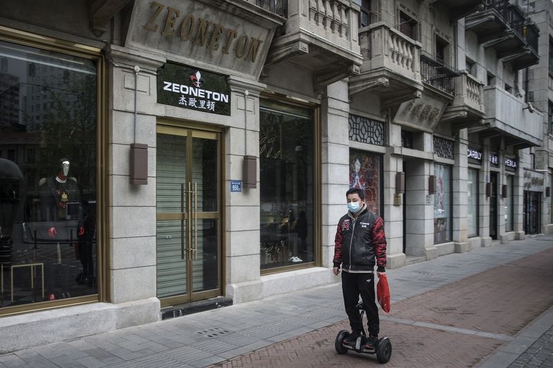 Trung Quoc keu goi nguoi dan 'thu gian, an uong va mua sam' hinh anh