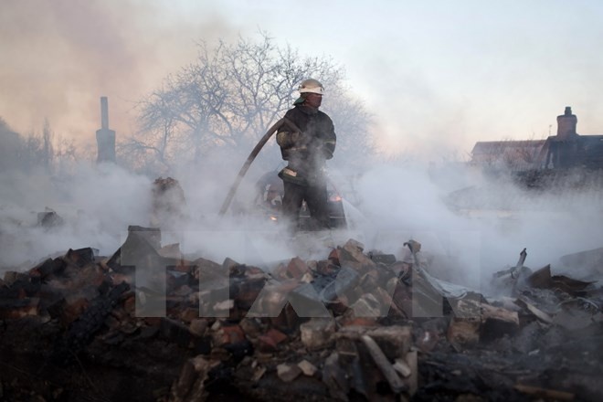 Nhin lai the gioi 2014: Nam cua nhung van de nan giai hinh anh