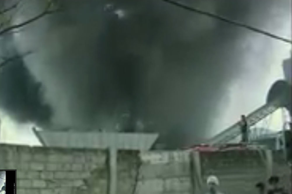 Lua khoi nghi ngut trong vu nha may giay Philippines chay hinh anh