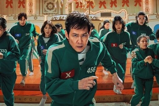 T.O.P bien mat o hinh anh quang ba 'Squid Game' hinh anh