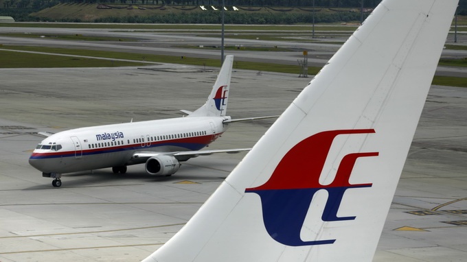 May bay Malaysia Airlines ha canh khan vi su co tren khong hinh anh