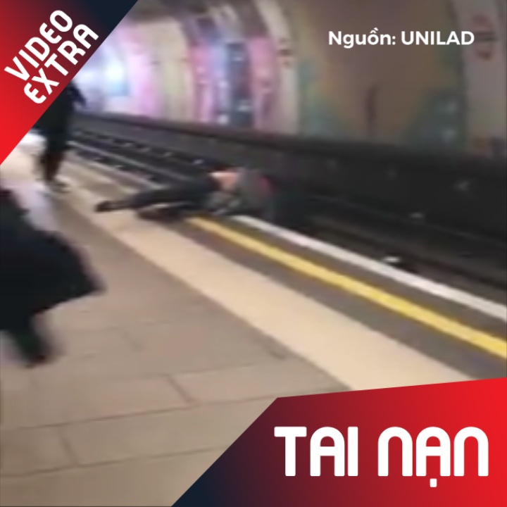 Hai nguoi dan ong Anh danh nhau, suyt chet duoi duong ray hinh anh