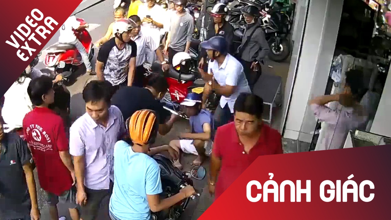 Nguoi dan vay bat 2 doi tuong khi dan canh cuop cua hinh anh