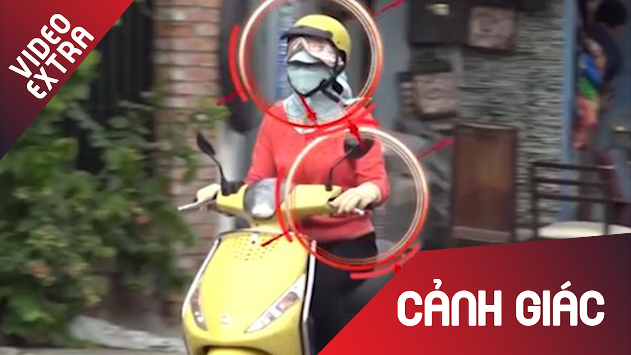 Nguy co tai nan giao thong khi mac vay chong nang hinh anh