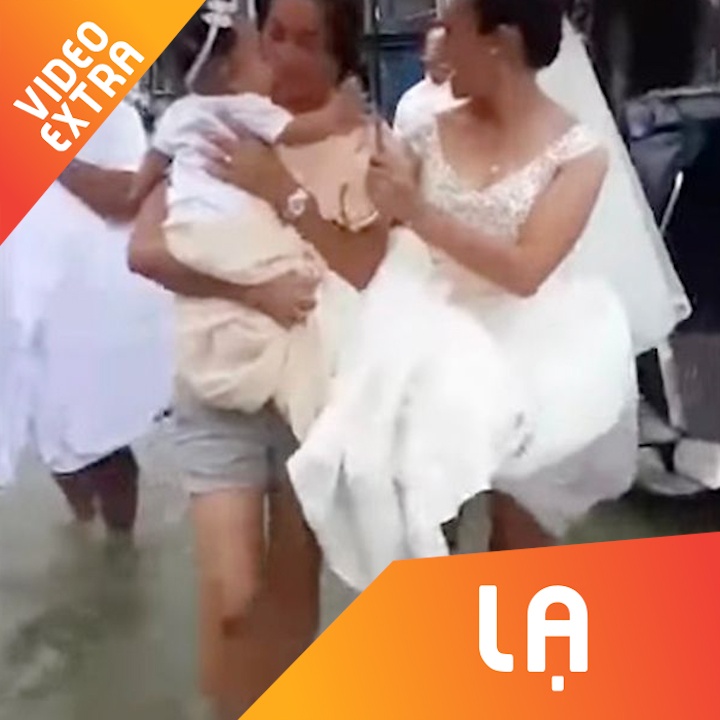 Co dau hon ho ven vay loi nuoc lu toi dam cuoi hinh anh