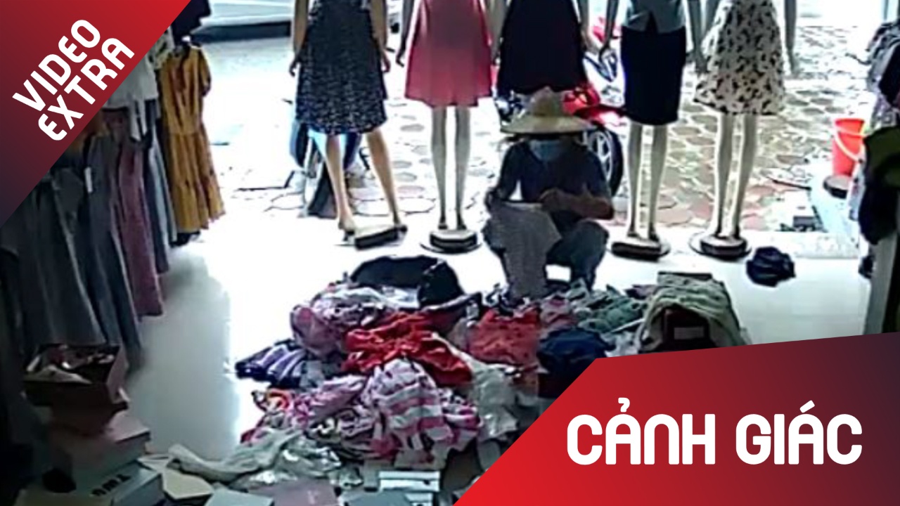 Thanh nien than nhien vao cua hang an cap do roi tu tu di ra hinh anh