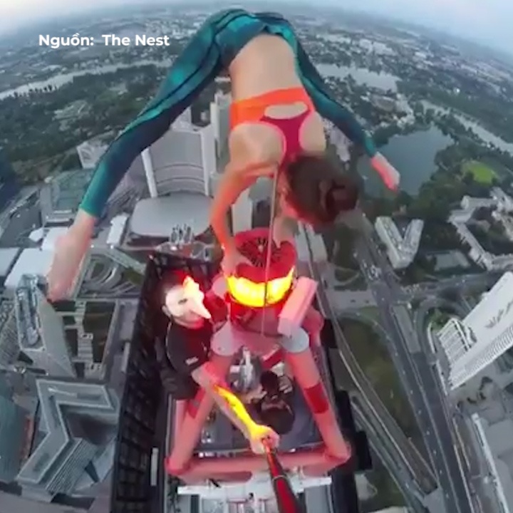 VDV mao hiem uon deo tren dinh toa nha choc troi hinh anh