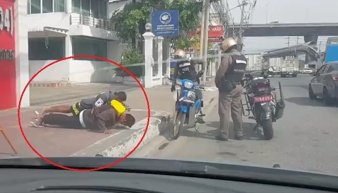 Khong doi mu bao hiem, thanh nien Thai nop phat bang chong day hinh anh