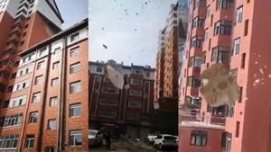 Nhung mang tuong lon cua toa chung cu bi gio cuon bay xuong dat hinh anh