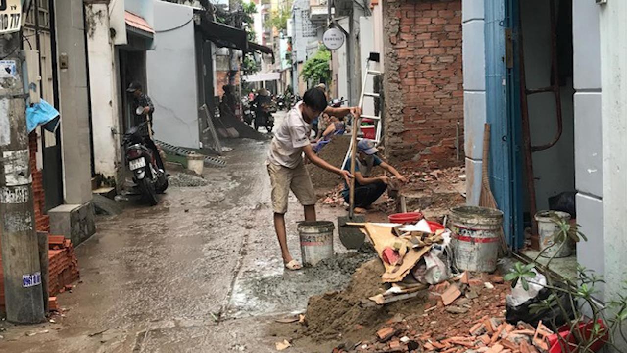 Nguoi dan TP.HCM hien dat 'vang' de mo hem hinh anh