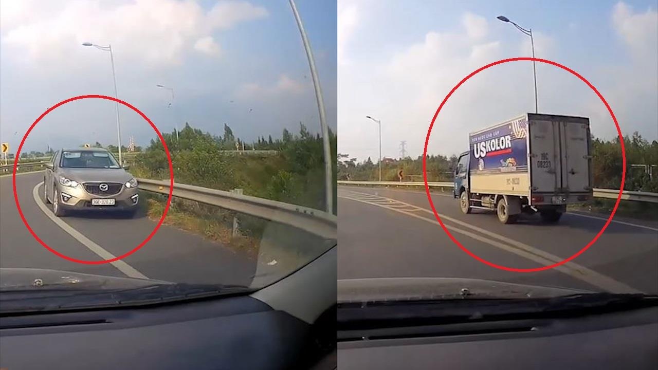 Oto va xe tai thay nhau di lui, chay nguoc chieu tren cao toc hinh anh