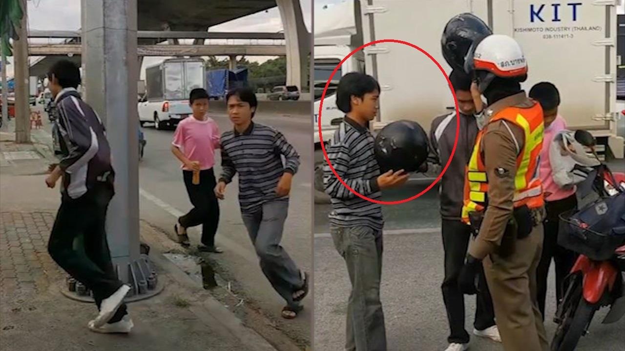 Canh sat bat tai xe chay quanh cot den vi khong doi mu bao hiem hinh anh