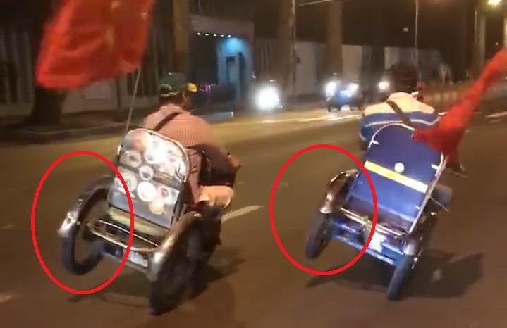 Xe 3 banh tu che chay nghieng bang 2 banh tren duong hinh anh