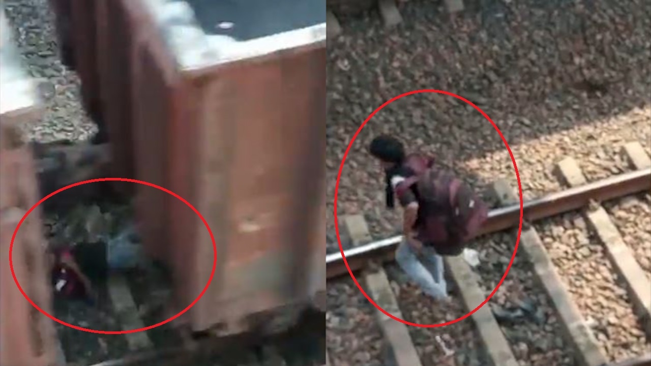 Nguoi dan ong thoat chet khi nam duoi duong ray xe lua hinh anh