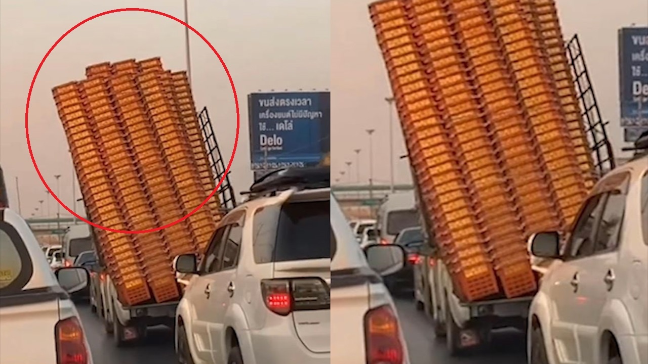 Xe cho thung nhua qua tai, nghieng nga tren duong hinh anh