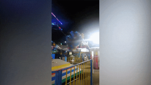 Tro choi du quay bi gay truc khien 2 nguoi roi xuong dat o Philippines hinh anh