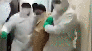 Nguoi nghi nhiem virus corona bi cuong che, keo den tram cach ly hinh anh