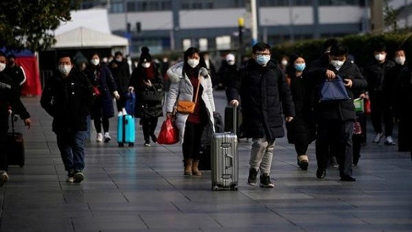 Nguoi dan Bac Kinh tro lai lam viec giua dich virus corona hinh anh