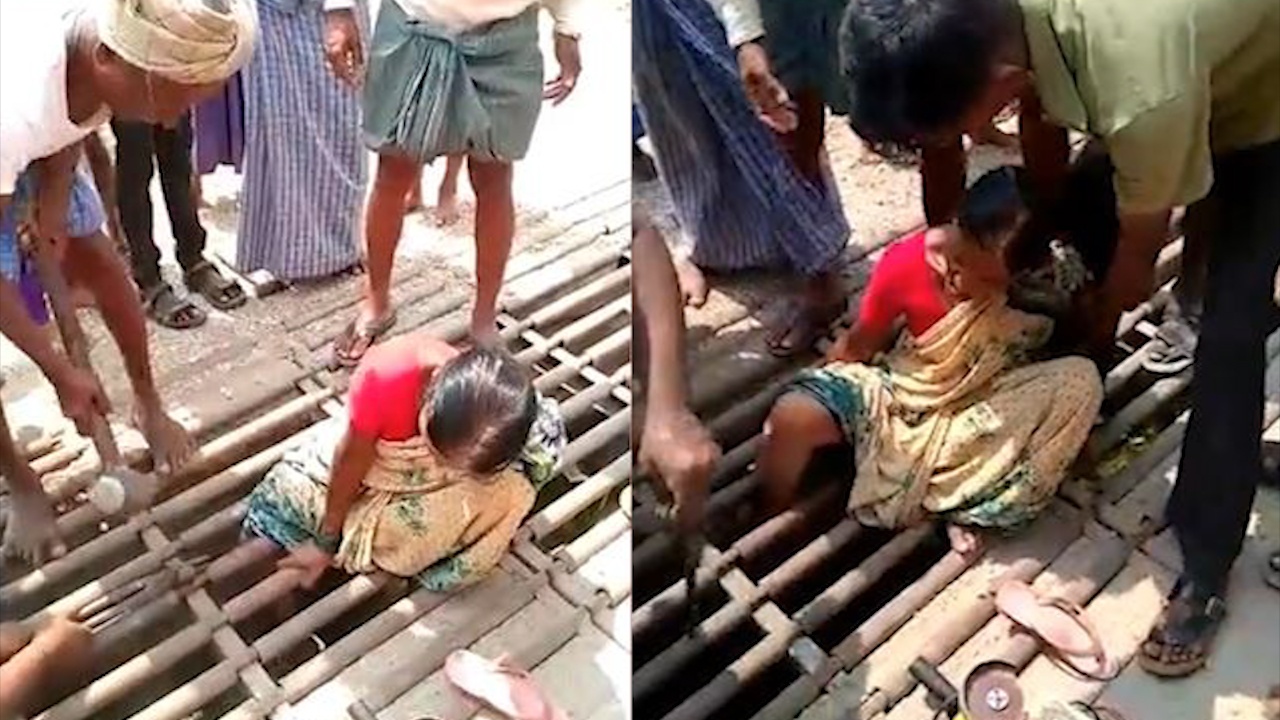 Dan lang giai cuu nguoi phu nu bi ket chan o mieng cong hinh anh