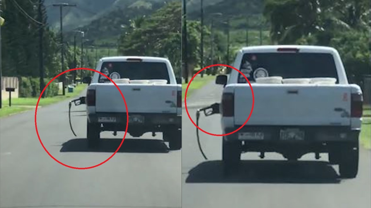 Tai xe bo quen voi bom xang tren oto dang chay hinh anh