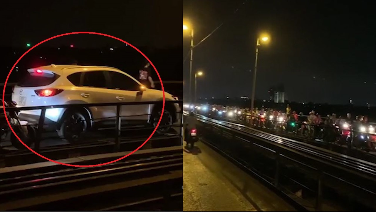 Oto di qua cau Long Bien gay un tac dai cho xe may hinh anh