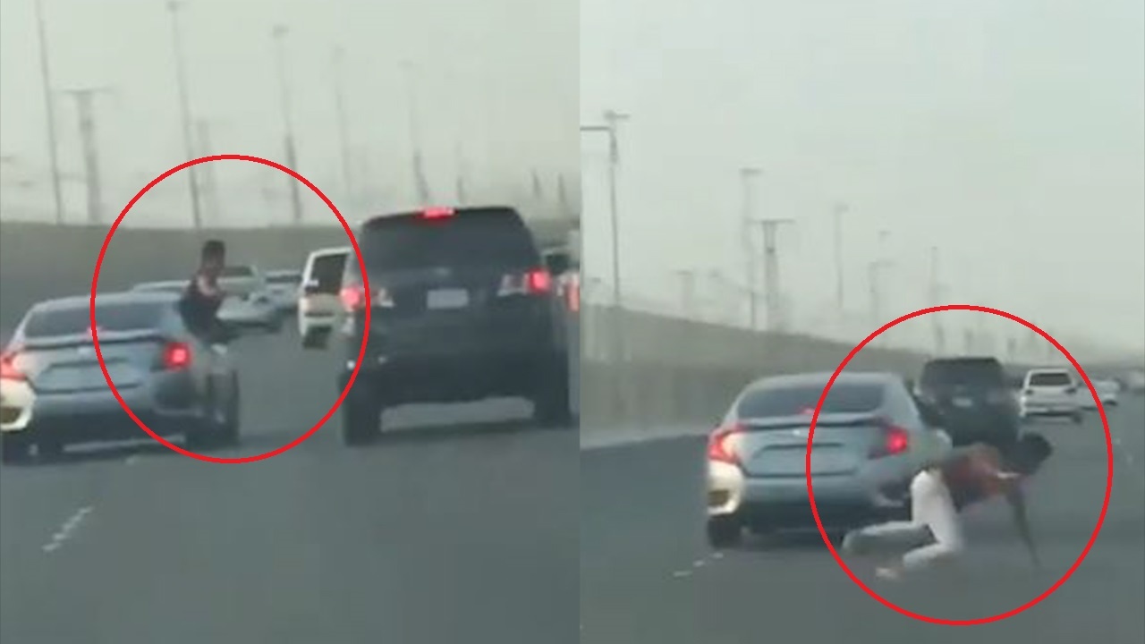 Nguoi dan ong nga khoi oto khi co nhoai nguoi tan cong xe khac hinh anh