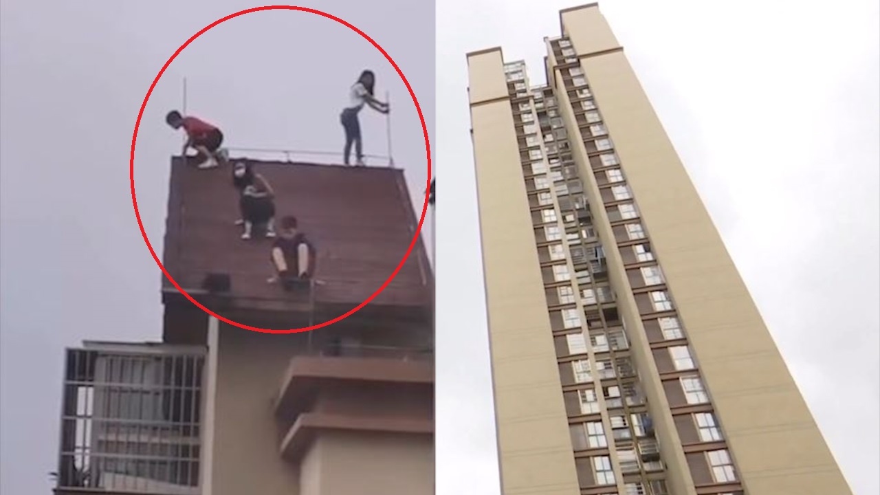 4 dua be lieu linh leo len noc toa nha 32 tang dua nghich o Trung Quoc hinh anh