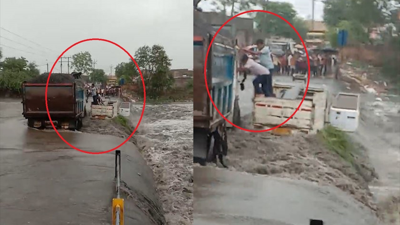 Mua lu cuon xe tai keo theo 3 nguoi roi xuong nuoc hinh anh