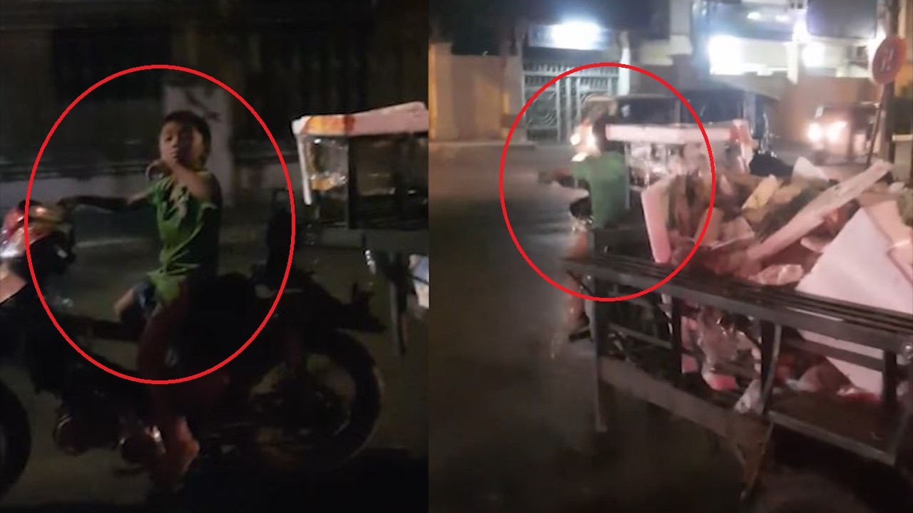 Be trai lai xe may keo ro mooc phia sau hinh anh