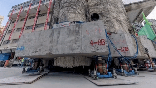 Di doi toa nha 7.000 tan o Trung Quoc hinh anh