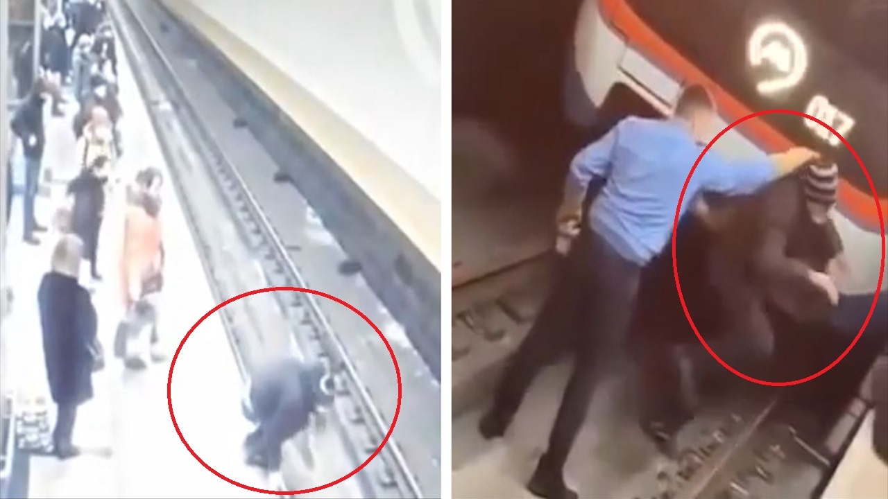 Nguoi dan ong nhay vao duong ray, chan doan tau di toi hinh anh