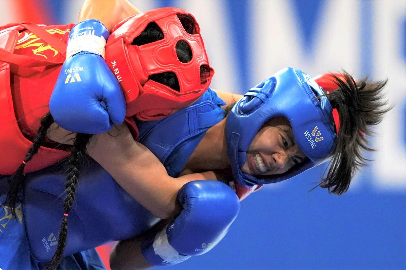 Nguyen Thi Trang danh bai VDV Thai Lan gianh HCV wushu hinh anh