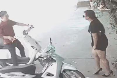 Nguoi phu nu bat trom meo roi giau trong vay hinh anh