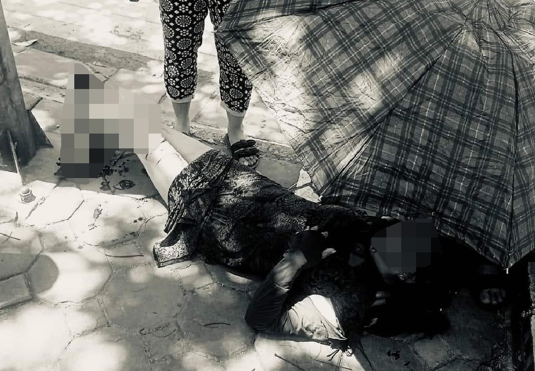 Ao chong nang cuon vao banh xe, nguoi phu nu gay gap co chan hinh anh