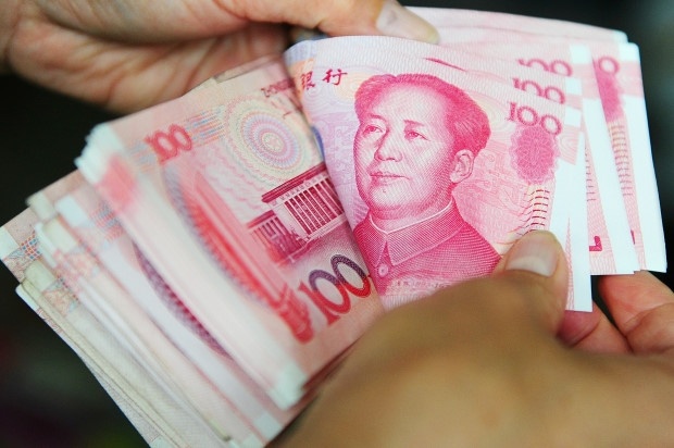 Cap vo chong bi to lua 400.000 nguoi o Trung Quoc hinh anh
