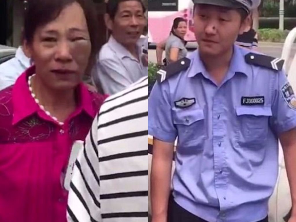 Canh sat Trung Quoc day nga nguoi phu nu giua duong pho hinh anh